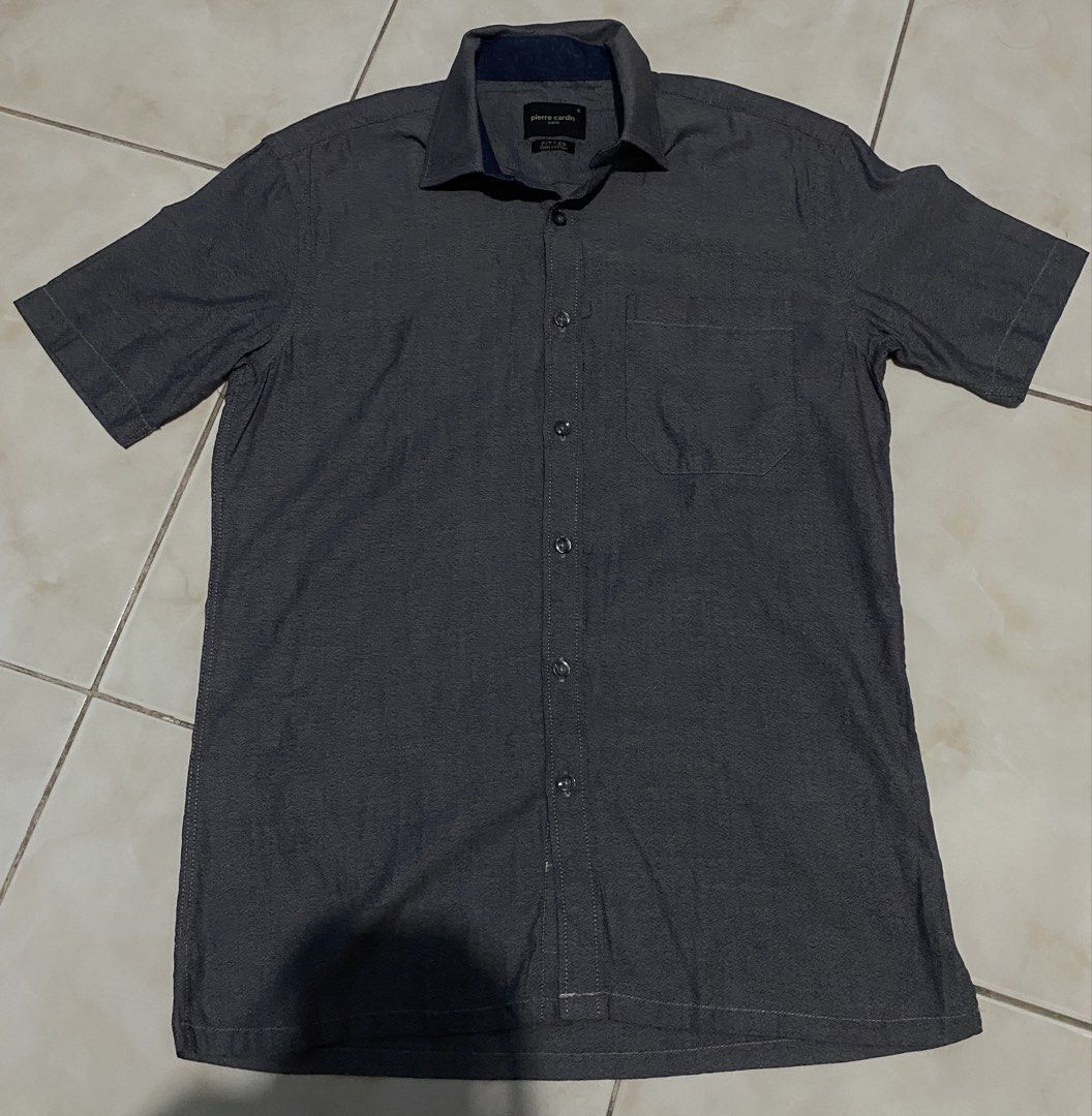Pierre Cardin Short Sleeve Button Up Shirt (Category: Tshirts & Polo Shirts ) located in Pasig City. Submitted by teddae (Listing ID 1460266177, Image 1). Description: For Sale Pierre Cardin Short-Sleeve Button-up - Dark Gray Textured Fabric crisp collar size S length 27.5 width 19 sleeves 9 no issues, not used can do COD/Gcash mop or meetup if nearby -buyer will handle the shipping fee-.