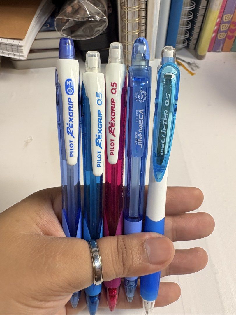 Pilot Rexgrip & Uni-ball Uni-Clifter Mechanical Pencil Set (Category: Stationery & School Supplies) located in Pasig City. Submitted by purplewingsph1 (Listing ID 1460106014, Image 1). Description: - Set of 5 quality pens - Includes Pilot Rexgrip pens in 0.3mm and 0.5mm - Features a pink Pilot Rexgrip 0.5mm - Also includes Zebra Jim-Meca 0.5mm - Comes with Uni-ball Uni-Clifter 0.5mm - Ideal for everyday writing tasks PAYO Only. Strictly no COD. (