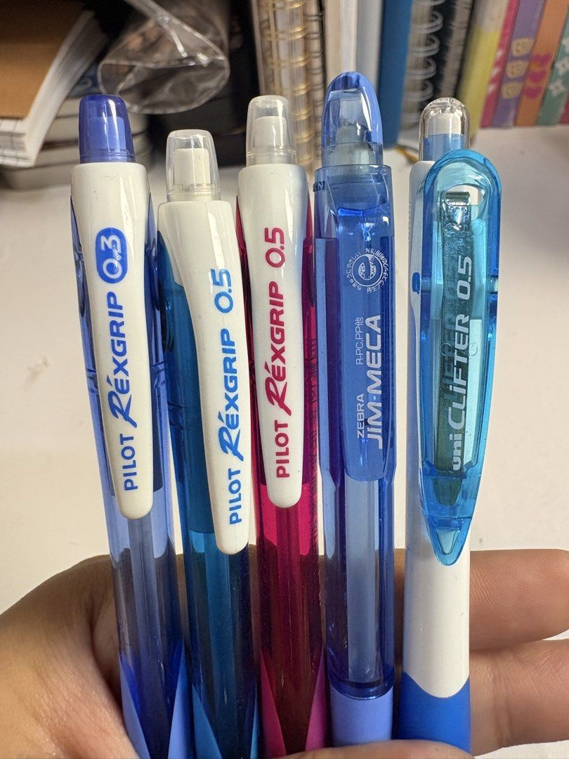 Pilot Rexgrip & Uni-ball Uni-Clifter Mechanical Pencil Set (Category: Stationery & School Supplies) located in Pasig City. Submitted by purplewingsph1 (Listing ID 1460106014, Image 2). Description: - Set of 5 quality pens - Includes Pilot Rexgrip pens in 0.3mm and 0.5mm - Features a pink Pilot Rexgrip 0.5mm - Also includes Zebra Jim-Meca 0.5mm - Comes with Uni-ball Uni-Clifter 0.5mm - Ideal for everyday writing tasks PAYO Only. Strictly no COD. (