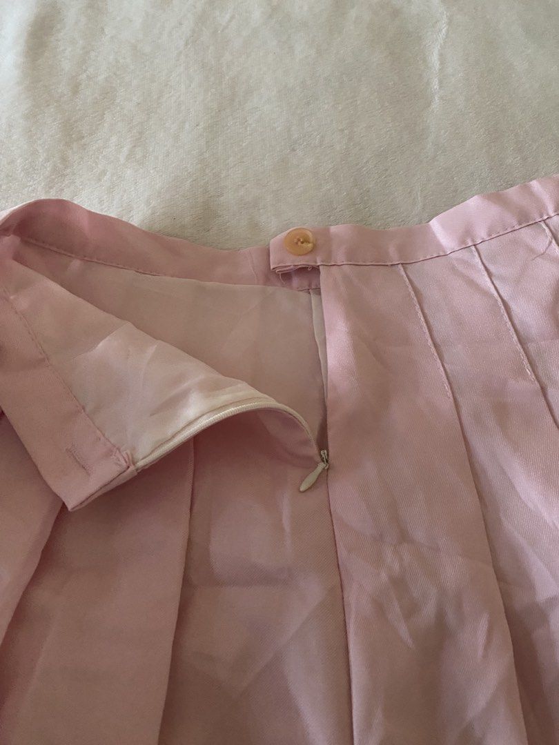 Pink Pleated Mini Skirt (Category: Skirts) located in Batangas. Submitted by v.ukay (Listing ID 1460132777, Image 2). Description: - Adorable pink pleated mini skirt - Side zipper closure - Button at the waist - Estimated size: Small to Medium - Versatile for casual outfits or dressing up - Easy to pair with various tops.