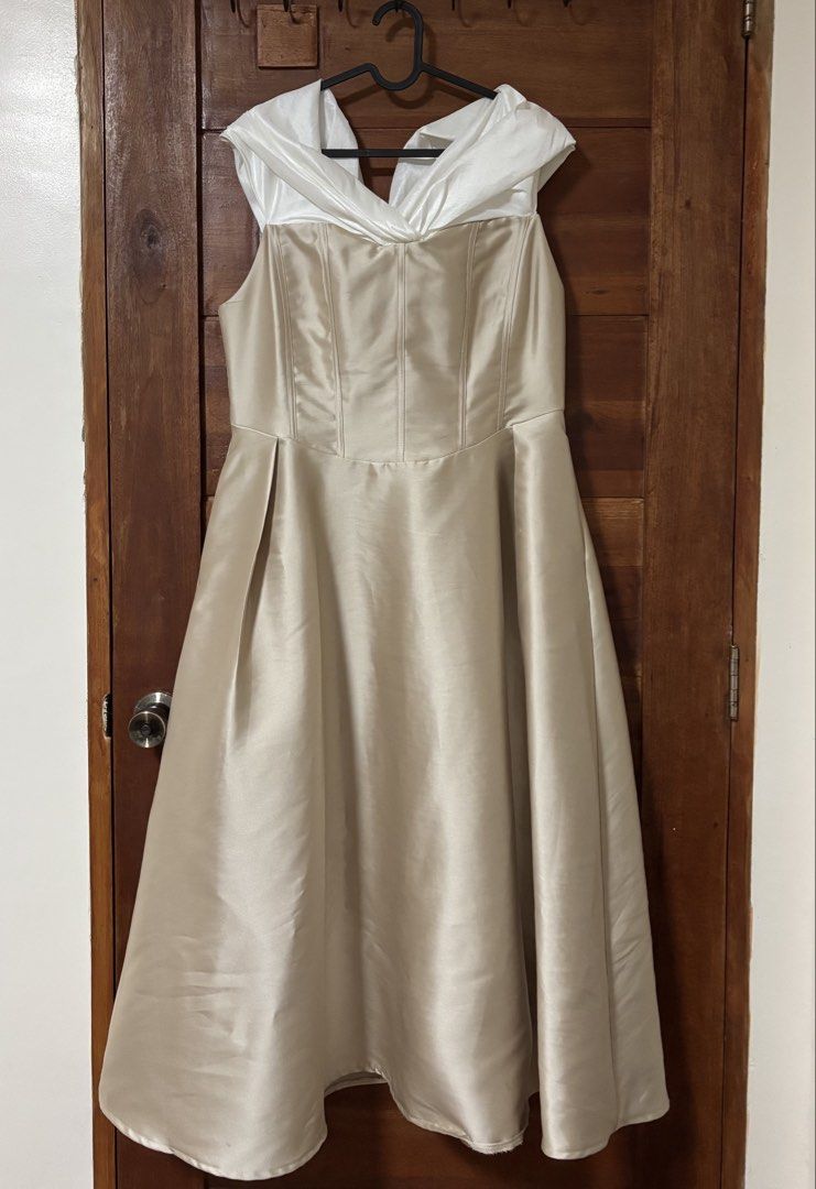 Karimadon Beige & White Gown (Category: Evening dresses & gowns) located in Trece Martires City. Submitted by decluttercloset_niks (Listing ID 1460280905, Image 3). Description: •used once on my graduation •garment bag included • altered the dress to ankle length (i'm 4'11") • XL on tag but fits up to 38inch waist • has pockets on both sides!! 📍 Trece Martires, Cavite 💸 MOP: GCash / Metrobank 🛵 MOD: Lalamove • Pay first — buyer shoulders the d