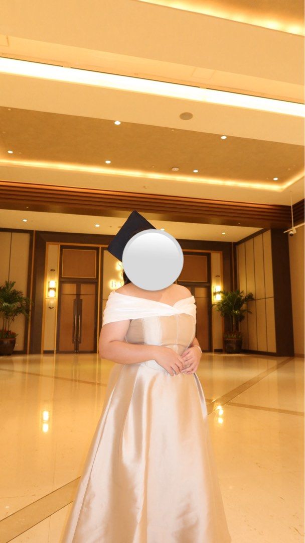 Karimadon Beige & White Gown (Category: Evening dresses & gowns) located in Trece Martires City. Submitted by decluttercloset_niks (Listing ID 1460280905, Image 2). Description: •used once on my graduation •garment bag included • altered the dress to ankle length (i'm 4'11") • XL on tag but fits up to 38inch waist • has pockets on both sides!! 📍 Trece Martires, Cavite 💸 MOP: GCash / Metrobank 🛵 MOD: Lalamove • Pay first — buyer shoulders the d
