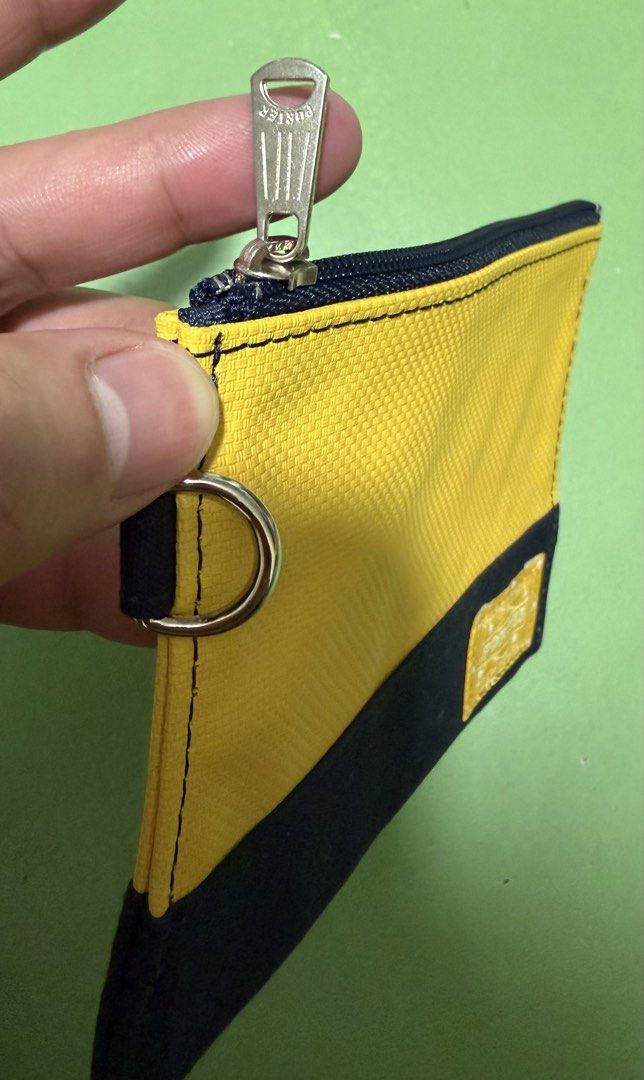 Pouch (Category: Luxury Bags & Wallets) located in Pasig City. Submitted by reyeslarry11740 (Listing ID 1460188646, Image 3). Description: For Sale Porter Yoshida Hand Pouch Canvas Good as new No issue May konting dumi lang, see last picture 1k plus ship only Payment 1st Pasig city.