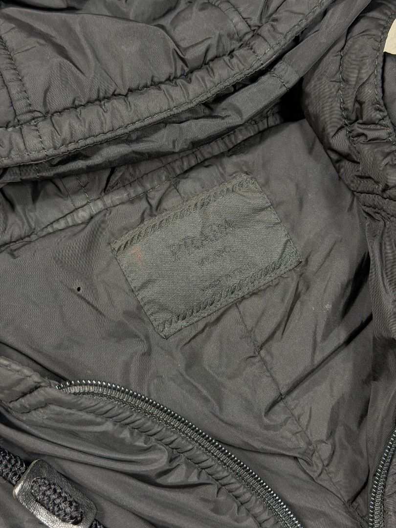 Prada- Vintage - Black Nylon Hoodie Down Jacket (Category: Luxury Apparel) located in Subic. Submitted by concretefloor (Listing ID 1460203784, Image 3). Description: Prada - Black Nylon Hoodie Down Jacket Size Small fits Medium 23 inches width 27 inches length Excellent condition Has scratch inside the jacket , can be fixed 9/10 condition Shipping fee not included Negotiable ; do not hesitate to make offer! .