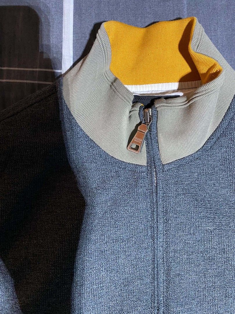 Prada Bomber Jacket Zip Up Grey XL (Category: Coats, Jackets and Outerwear) located in Manila. Submitted by raymondrob54698 (Listing ID 1460213699, Image 2). Description: - Grey Prada bomber jacket - Size XL - Zip-up front closure - Contrasting orange and grey collar - Ribbed cuffs and hem for a snug fit - Material: Polyester fiber and cotton - A great addition to your wardrobe!.