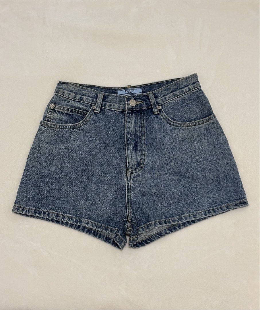 PRADA DENIM MOM SHORTS (Category: Shorts) located in Angeles City. Submitted by chic.haven (Listing ID 1460294084, Image 1). Description: - Authentic Prada Blue Denim Shorts - Sise 26-27 - Made in Italy - Iconic Prada Triangle Logo on Back Pocket - Perfect for Casual Wear.