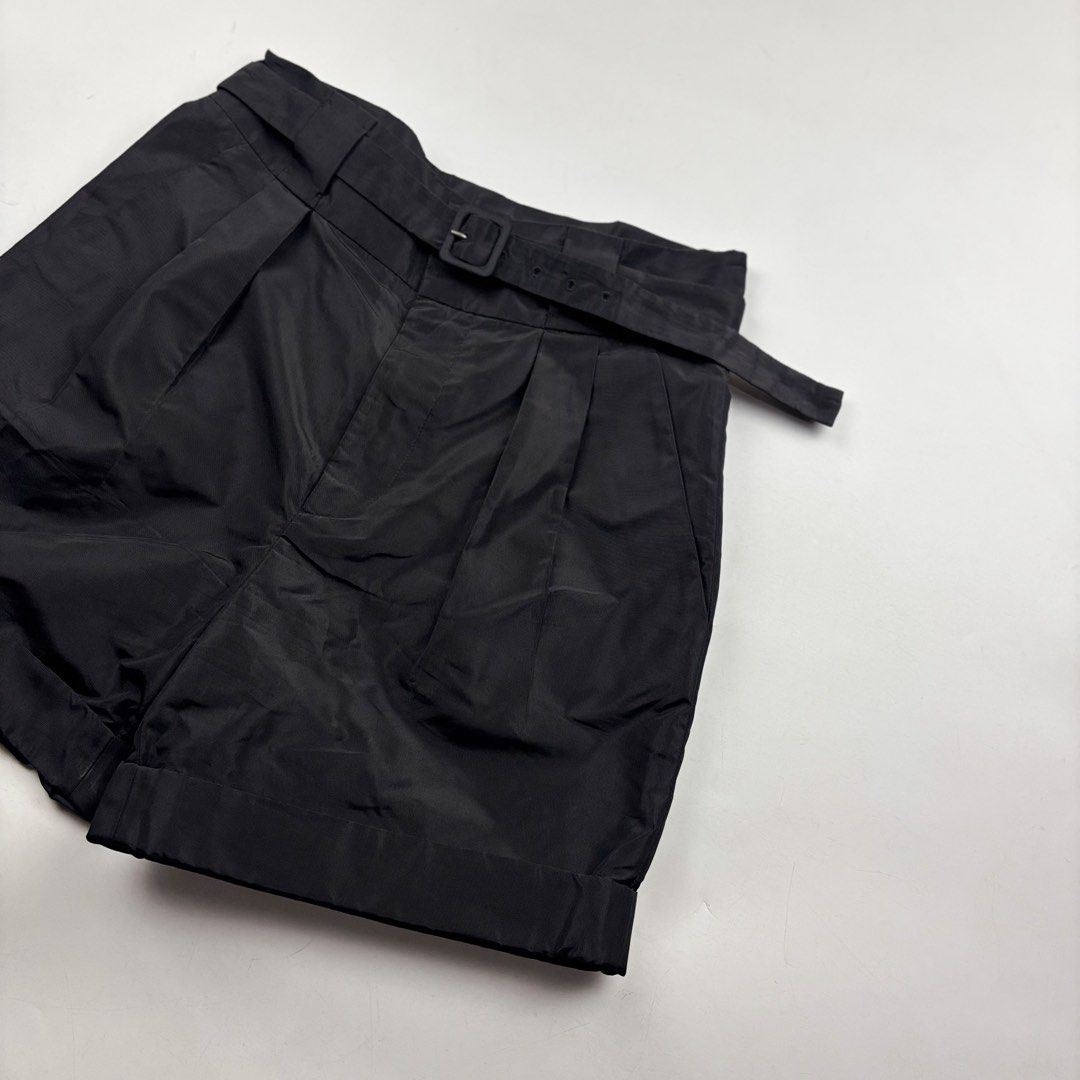 Prada High Waist Belted Pleated Shorts (Category: Shorts) located in Makati City. Submitted by ragrepository (Listing ID 1460247961, Image 3). Description: Prada High Waist Belted Pleated Shorts Tagged as 38 fits 27 waist. Waist-13.5 Front rise-13.5” Back rise-14.5” Inseam- Outseam-17.5” Thigh- Knee- Leg opening-11” Condition- 9.5/10 Flaw- None .