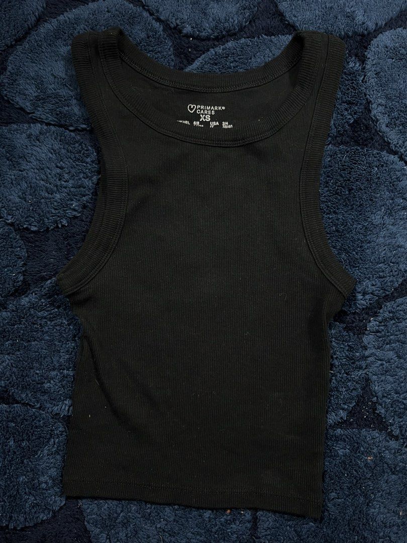 Primark Cares Black Ribbed Tank Top XS (Category: Sleeveless) located in Manila. Submitted by camieday04 (Listing ID 1460149593, Image 1). Description: - Brand: Primark Cares - Color: Black - Style: Ribbed Tank Top - Size: XS - Features: Sleeveless, Racerback cut - Material: Stretchy for comfort - Versatility: Great for layering or wearing alone.
