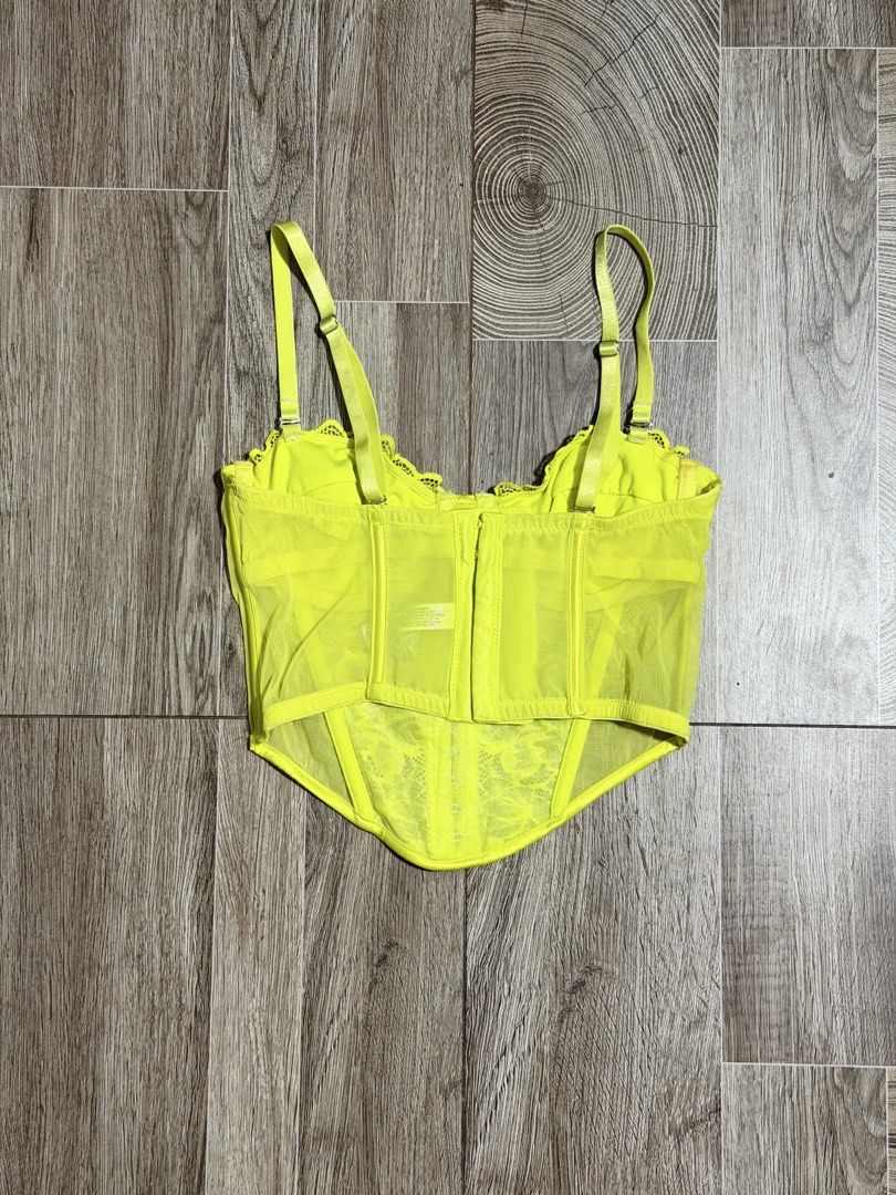 Primark Neon Lace Corset (Category: Others Tops) located in Bacoor. Submitted by pinkzloverz222 (Listing ID 1460176893, Image 3). Description: Primark neon yellow lace and mesh corset-style camisole top with adjustable spaghetti straps. issue: pink stain pero sa loob naman hindi sya visible pag suot, check last 2 photos 150+sf.