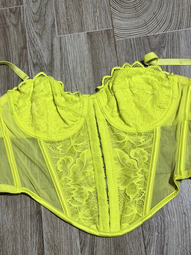 Primark Neon Lace Corset (Category: Others Tops) located in Bacoor. Submitted by pinkzloverz222 (Listing ID 1460176893, Image 2). Description: Primark neon yellow lace and mesh corset-style camisole top with adjustable spaghetti straps. issue: pink stain pero sa loob naman hindi sya visible pag suot, check last 2 photos 150+sf.