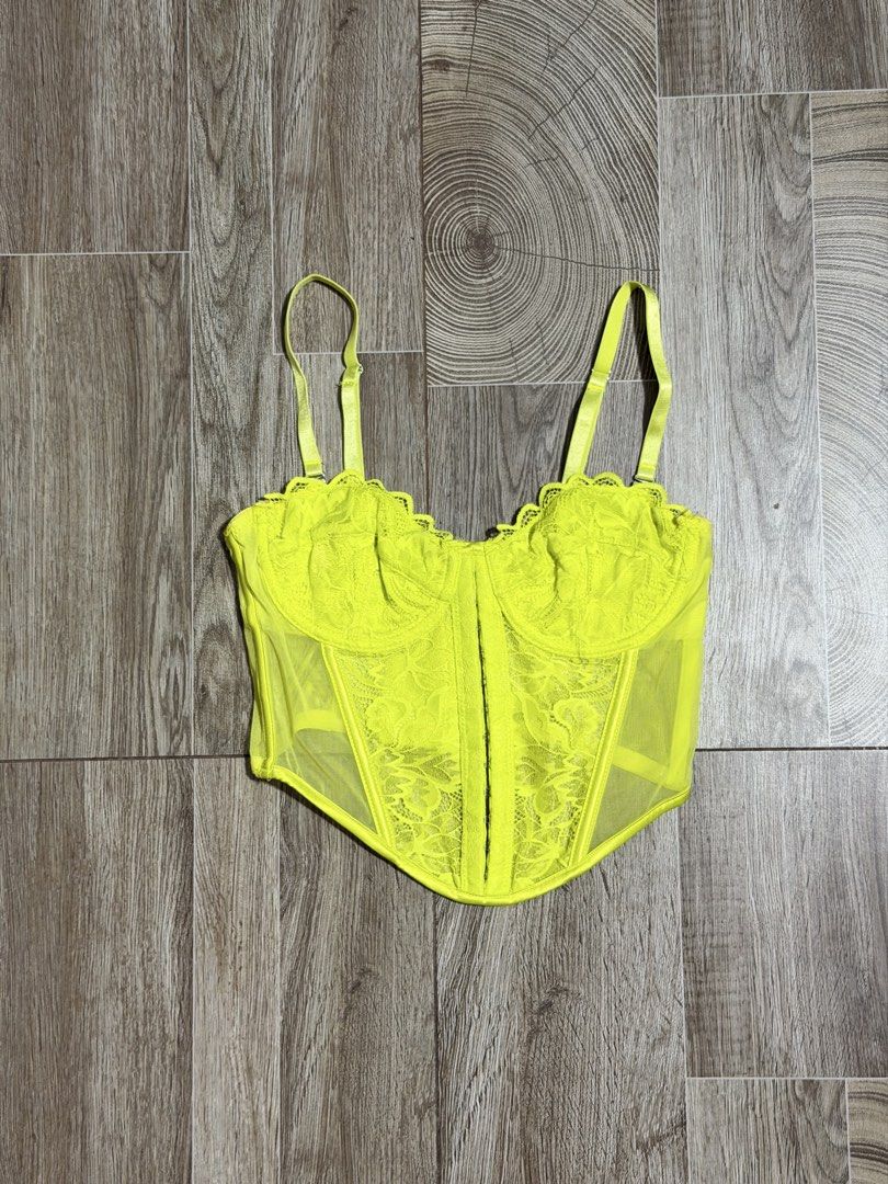 Primark Neon Lace Corset (Category: Others Tops) located in Bacoor. Submitted by pinkzloverz222 (Listing ID 1460176893, Image 1). Description: Primark neon yellow lace and mesh corset-style camisole top with adjustable spaghetti straps. issue: pink stain pero sa loob naman hindi sya visible pag suot, check last 2 photos 150+sf.