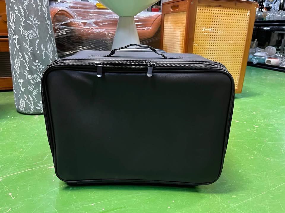 Professional Makeup Artist Trolley Rolling Suitcase (Category: Makeup) located in Antipolo. Submitted by istitikfordago (Listing ID 1460221644, Image 1). Description: - Sleek black rolling makeup case - Retractable handle and wheels for effortless transport - Multiple compartments and brush holders inside - Includes a clear zippered pocket - Comes with a separate zippered pouch - Extra wheels included in a plastic bag - Ideal for professional mak