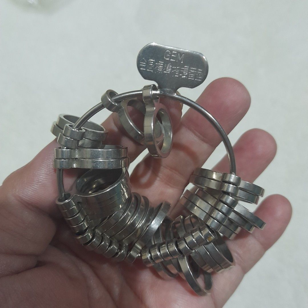 Professional Ring Sizer Gauge Set (Category: Rings) located in Bocaue. Submitted by marajapansurplus (Listing ID 1460238254, Image 2). Description: - selling as it is - set of ring sizer gauges - Durable metal construction - Includes a key for easy opening and closing - All pieces attached to a ring for organization - Ideal for jewelers or personal ring sizing needs.