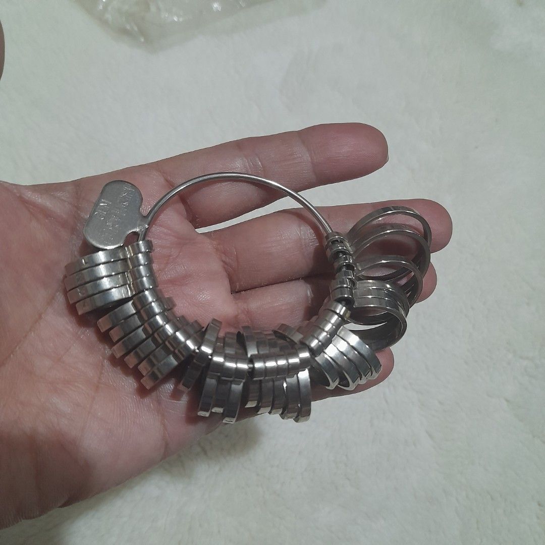 Professional Ring Sizer Gauge Set (Category: Rings) located in Bocaue. Submitted by marajapansurplus (Listing ID 1460238254, Image 1). Description: - selling as it is - set of ring sizer gauges - Durable metal construction - Includes a key for easy opening and closing - All pieces attached to a ring for organization - Ideal for jewelers or personal ring sizing needs.