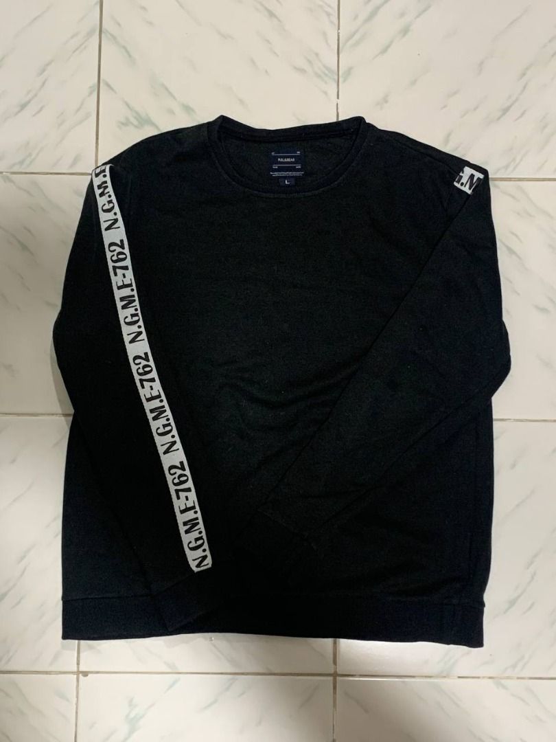 Pull & Bear Black Sweatshirt with Logo Tape Detail (Category: Coats, Jackets and Outerwear) located in Marikina City. Submitted by cosmicfish_aad03c (Listing ID 1460146480, Image 1). Description: Pull & Bear black long-sleeved sweatshirt, size L. Features white logo tape on the left sleeve and a small logo on the right shoulder. Crew neck. L - 24 W - 18.