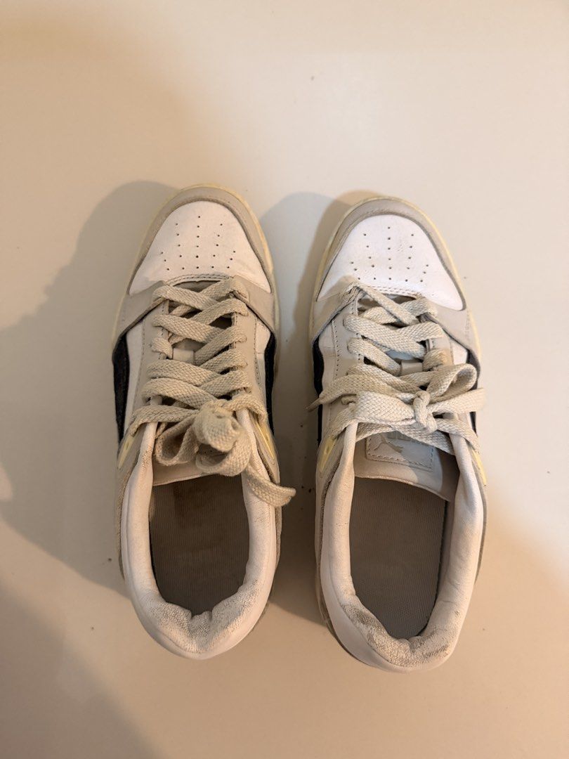 Puma White and Grey Sneakers (Category: Sneakers) located in Floridablanca. Submitted by retroretrieve (Listing ID 1460205687, Image 3). Description: - Puma Sneakers - Color: White and Grey - Size: UK 6 (EUR 39 / US 7) - Condition: Used, with visible wear on soles and edges - fits us 8 - original.