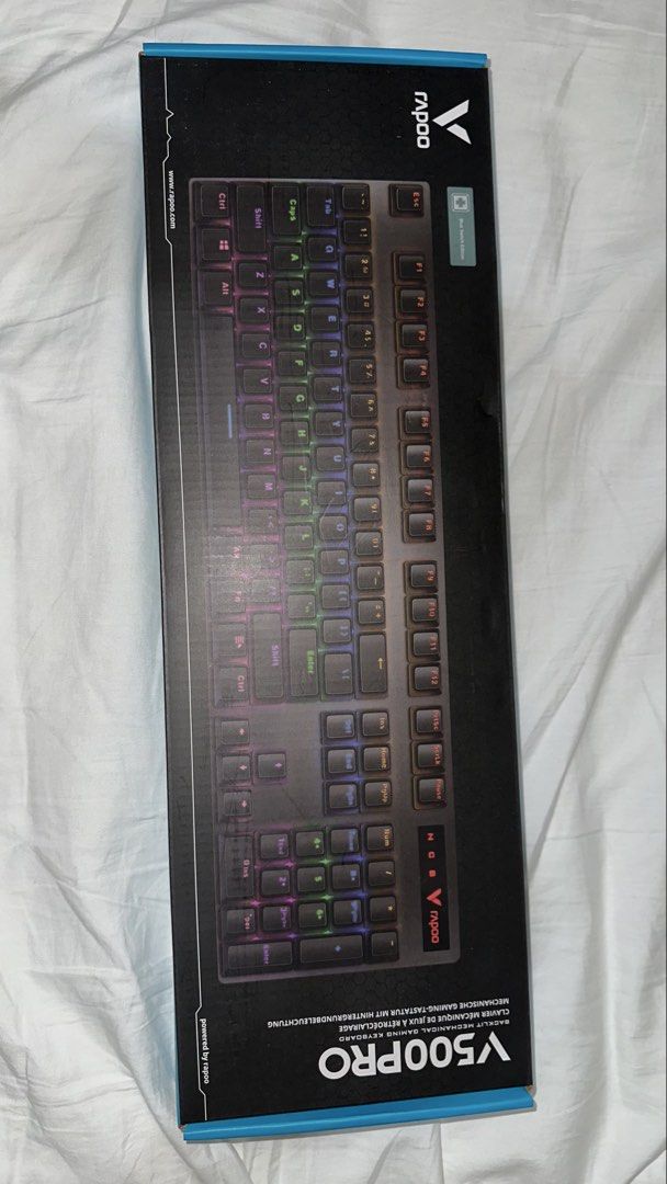 Rapoo V500PRO Mechanical Gaming Keyboard (Blue Switch Edition) (Category: Computer Keyboard) located in Manila. Submitted by zo.ignacio (Listing ID 1460288105, Image 1). Description: Brand new, unopened, and factory-sealed in its original box. Perfect for gaming, office work, or casual typing. Key Features: Mechanical Blue Switches: Tactile feedback with a satisfying clicky response, rated for up to 50 million keypresses. Full-Sized Layout: Inclu