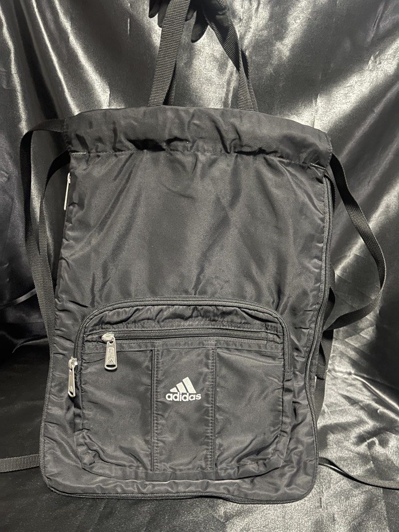 Rare 90’s ADIDAS Drawstring Bag (Category: Backpacks) located in Manila. Submitted by Ms.Joycee (Listing ID 1460105844, Image 2). Description: Still in EXCELLENT CONDITION ✨ •Material: polyester •Closure: Drawstring, Snap button, & zipper •Adjustable cord straps •Zippered front compartment •Large open compartment •Style: Sports / gym / casual •Lightweight.