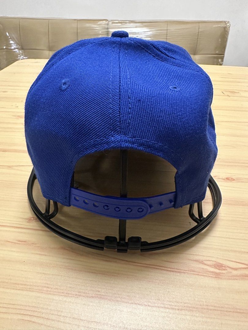 RAUH-Qelt Caps Royal Blue Snapback Hat (Category: Caps & Hats) located in Quezon City. Submitted by mancave_stuff (Listing ID 1460111188, Image 3). Description: - Royal blue WIP Caps snapback hat - Features 'RWB' logo on the front - 'Car Porn Racing' detail on the side - Adjustable strap for a custom fit - Interior WIP Caps branding - Ideal for car enthusiasts.