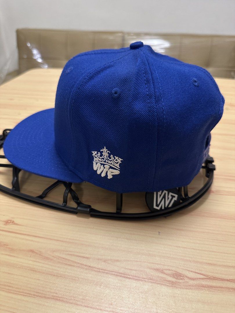 RAUH-Qelt Caps Royal Blue Snapback Hat (Category: Caps & Hats) located in Quezon City. Submitted by mancave_stuff (Listing ID 1460111188, Image 2). Description: - Royal blue WIP Caps snapback hat - Features 'RWB' logo on the front - 'Car Porn Racing' detail on the side - Adjustable strap for a custom fit - Interior WIP Caps branding - Ideal for car enthusiasts.
