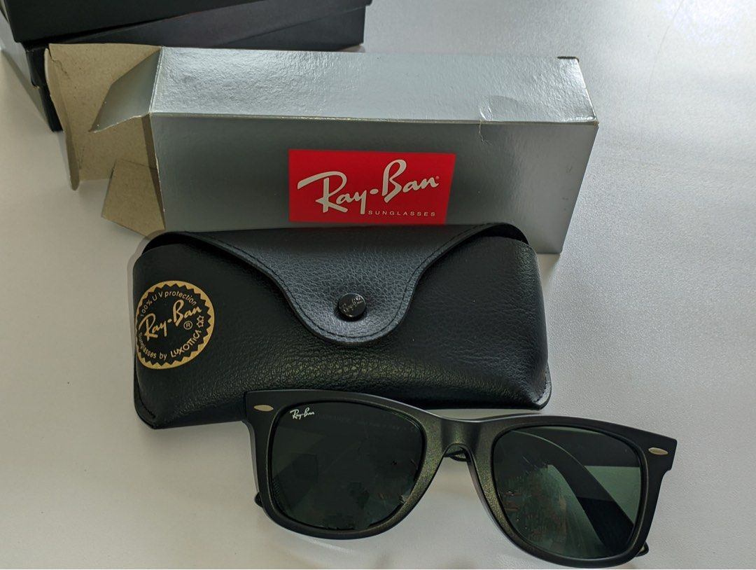 Ray-Ban Sunglasses with Case and Box (Category: Sunglasses & Eyewear) located in Manila. Submitted by sirloncelot (Listing ID 1460106400, Image 1). Description: - Classic Ray-Ban sunglasses - Black frame with green lenses - Comes with original black leather case and Ray-Ban box - Offers 100% UV protection - Ideal for everyday wear.