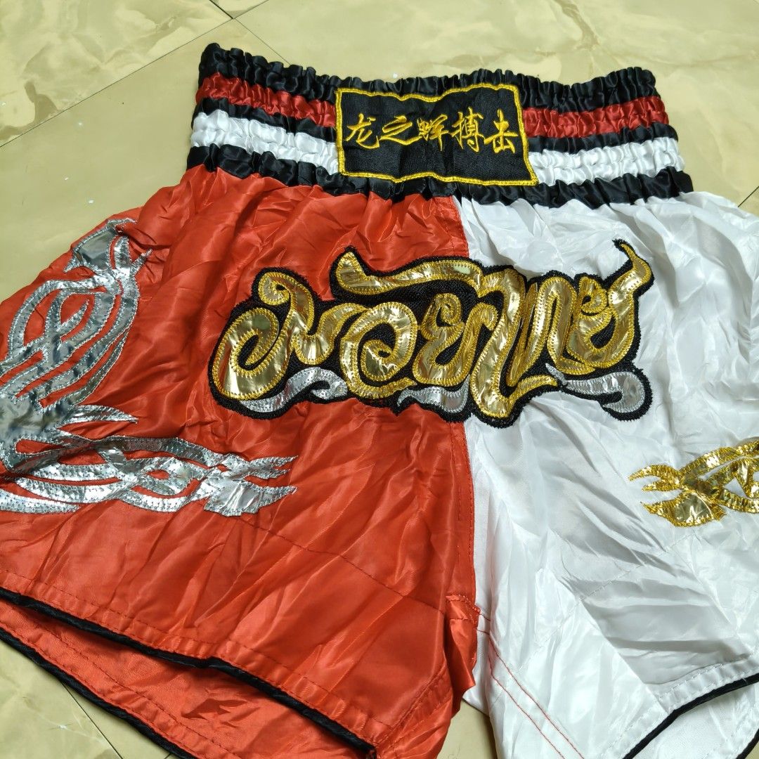 Red and white split-color Muay Thai Shorts (Category: Shorts) located in Rizal. Submitted by closefit (Listing ID 1460247391, Image 3). Description: READ ME ❣ Accessories not included 💝 On hand and ready to ship. 💢 Actual color may vary due to lightning. 💦 I advise to wash the item before using. 💦 FIRST ONE TO PAY GETS THE ITEM. 🦴 Materials: 100% polyester ‼️ Medium MOP: ‼️ GCASH ‼️ Bank transaction Loc: ‼️ Cainta Rizal.
