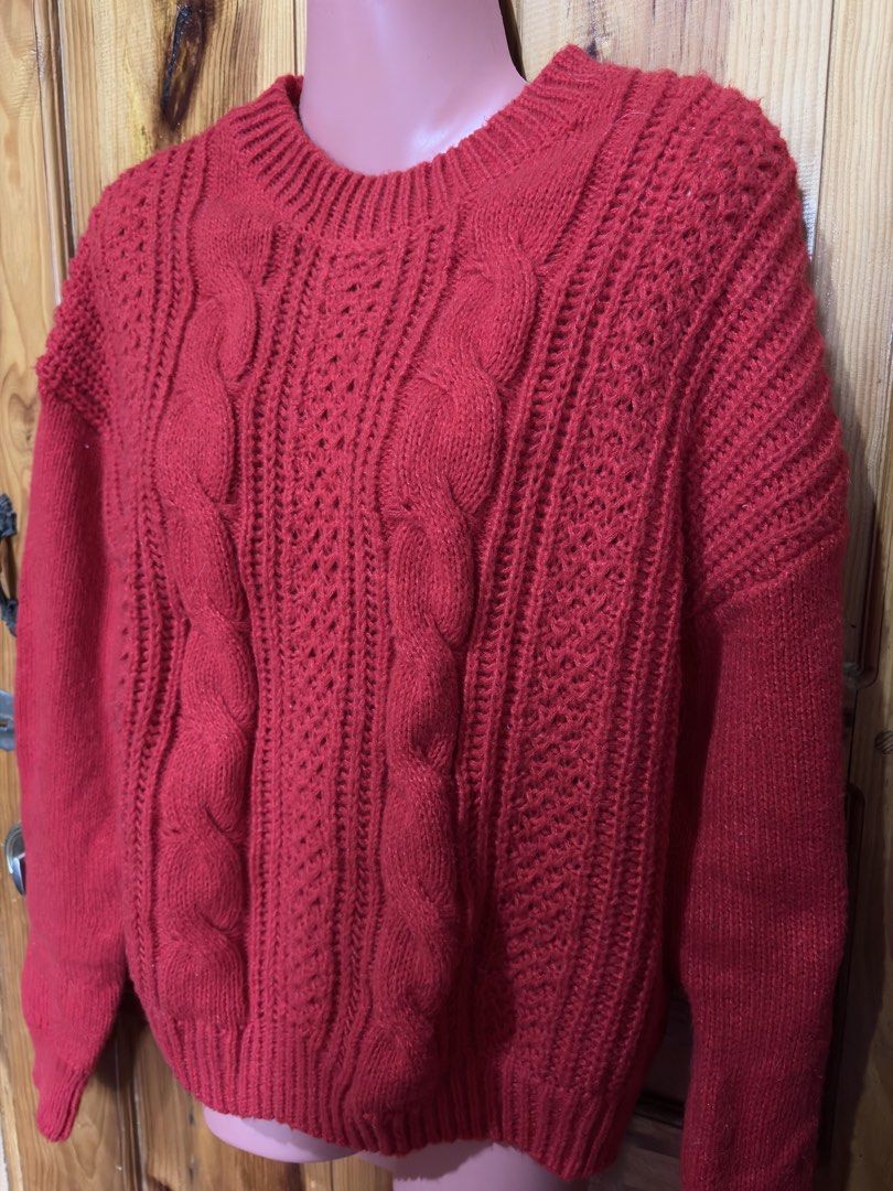 Red Cable Knit Sweater (Category: Coats, Jackets and Outerwear) located in Baguio. Submitted by declutterbycys (Listing ID 1460121337, Image 3). Description: - Cozy red sweater - Classic cable knit design - Comfortable crew neck - Perfect for layering or wearing alone - Ideal for cooler weather - Pairs well with jeans or skirts Note: Color may vary due to lighting.