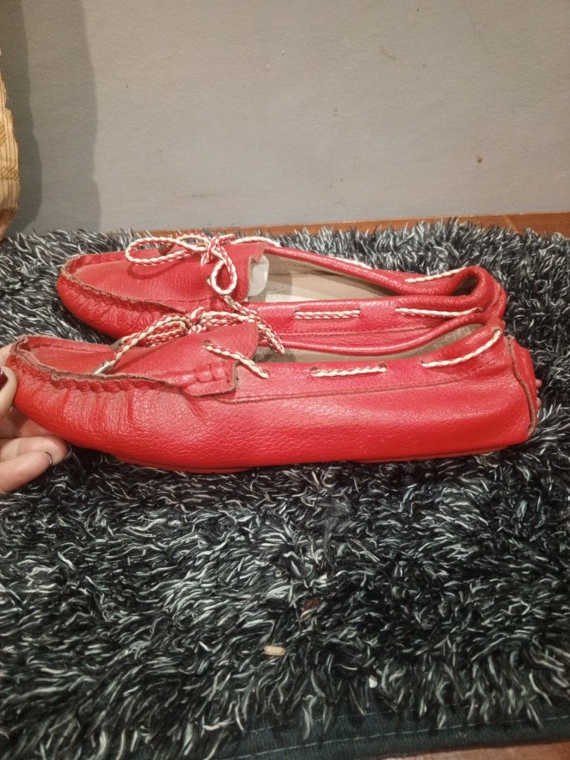 Red Leather Moccasins (Category: Loafers) located in Manila. Submitted by arianne070692 (Listing ID 1460292811, Image 2). Description: - Classic red leather moccasins - Easy slip-on style - Features white laces for a stylish touch - Textured grip sole for added traction - Size: 240 (equivalent to 1.5) - Origin: Made in China - Ideal for casual wear.