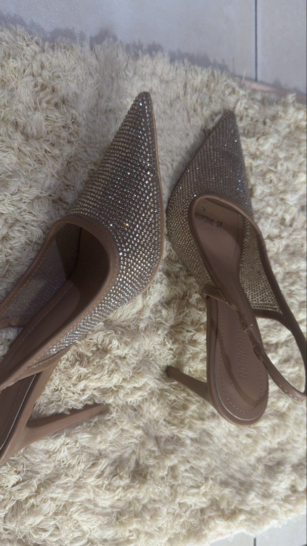 Rococo Slingback Heels with Rhinestones (Category: Heels) located in Pateros City. Submitted by montoyalyk92949 (Listing ID 1460160883, Image 3). Description: - Dazzling slingback heels covered in rhinestones - Chic nude-colored straps and sole - Elegant pointed toe design - Sexy high stiletto heel - Ideal for parties and special occasions - Designed for comfort, even for extended wear.