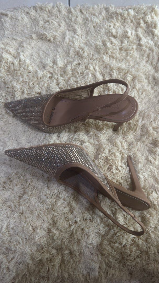 Rococo Slingback Heels with Rhinestones (Category: Heels) located in Pateros City. Submitted by montoyalyk92949 (Listing ID 1460160883, Image 1). Description: - Dazzling slingback heels covered in rhinestones - Chic nude-colored straps and sole - Elegant pointed toe design - Sexy high stiletto heel - Ideal for parties and special occasions - Designed for comfort, even for extended wear.