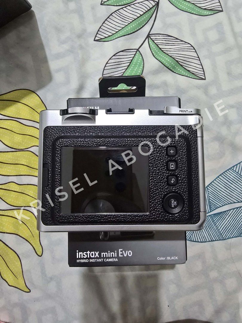 Instax Mini Evo Black (Category: Cameras) located in Quezon City. Submitted by kriselap (Listing ID 1460222837, Image 3). Description: 📸 INSTAX MINI EVO – BLACK FOR SALE 💰 Selling Price: 7,500 Inclusions: • Original Box • Original USB Cable • 32GB SD Card • Strap Case No Issues and barely used RFS: No longer using it and need funds. 📍 Preferred Meet-Up: Around QC Area or Cainta, Rizal 🚚 For Delivery: Payment first. Buyer will book and shoulde