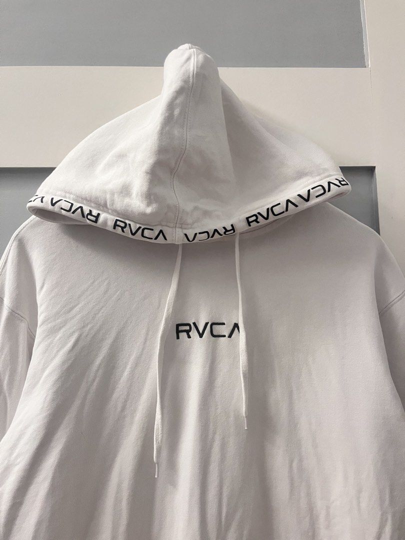 RVCA White Hoodie Size S (Category: Hoodies) located in Calasiao. Submitted by cristinabarongan5 (Listing ID 1460192829, Image 2). Description: - White RVCA hoodie - RVCA logo on chest - Repeated RVCA branding on hood lining - Front kangaroo pocket - Made from a comfortable cotton blend - Size: S - Dimension 23 x 27.