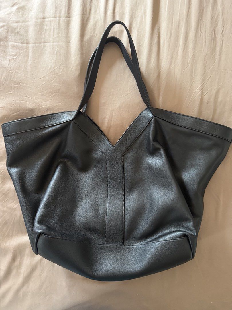 Saint Laurent YTote (Category: Luxury Bags & Wallets) located in Caloocan City. Submitted by iris.daph (Listing ID 1460219731, Image 1). Description: - Authentic Saint Laurent Y tote - My grandparents bought it for me last year for school, but rarely used it. - Love the slouchy leather, but the bag was too big for the little stuff I carried :”) - comes with the original card, but replacing the dust bag and lost the box to the flood recently 💔.