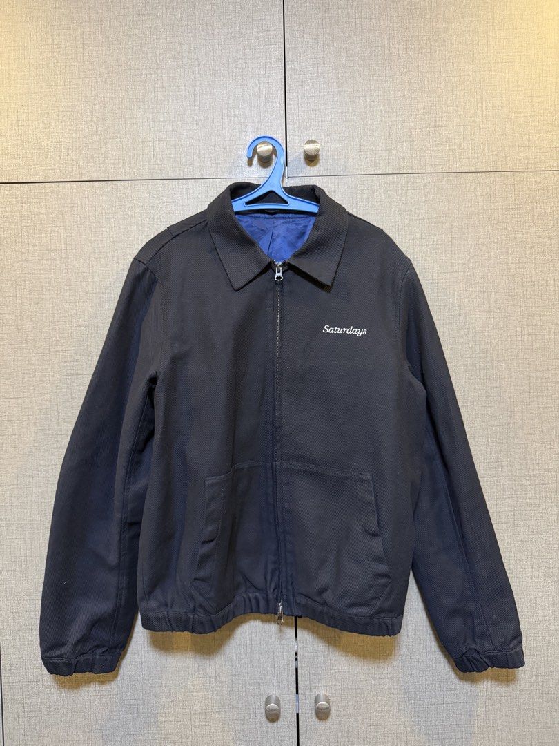 Saturdays NYC Black Zip-Up Jacket (Category: Coats, Jackets and Outerwear) located in Manila. Submitted by johnthecurator (Listing ID 1460243785, Image 1). Description: - Saturdays NYC black jacket - Zip-up front closure - Two functional front pockets - Vibrant blue interior lining - Classic collar design - 21x25.