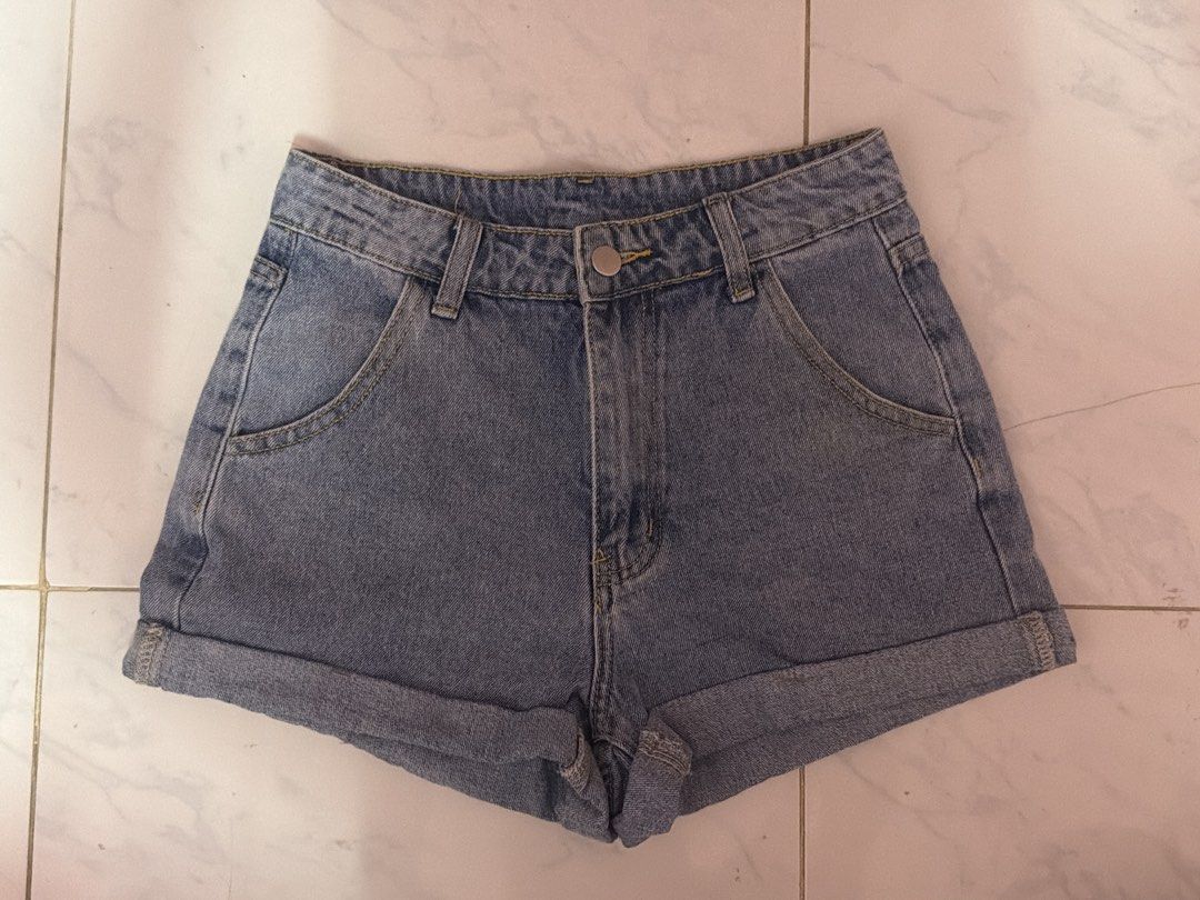 SHEIN Blue Denim High Waisted Cuffed Shorts (Category: Shorts) located in Iligan City. Submitted by my.preloved29 (Listing ID 1460274897, Image 1). Description: - SHEIN blue denim shorts - High-waisted style - Cuffed hems - Button and zip closure - Two front pockets - Ideal for casual wear.