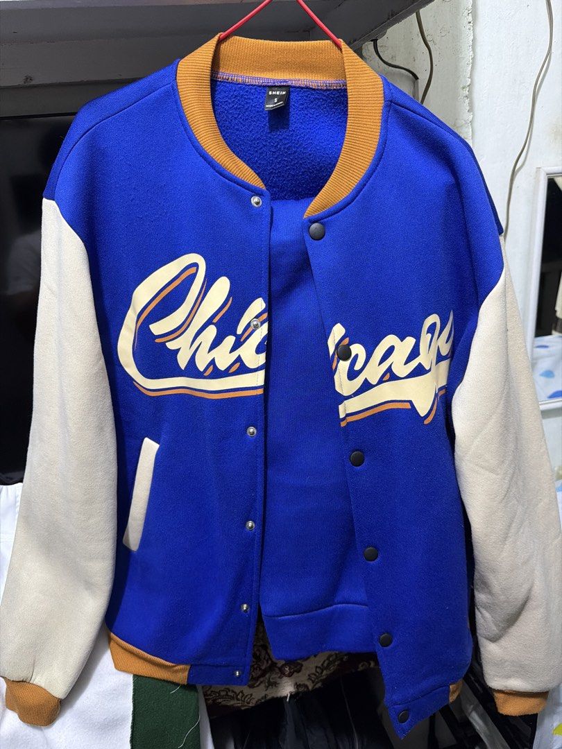 SHEIN Blue Varsity Jacket with Cream Sleeves (Category: Sets & Coordinates) located in Manila. Submitted by thequeennn (Listing ID 1460251987, Image 1). Description: - SHEIN Blue Varsity Jacket w/ blue pants - Size: S - Color: Blue with cream sleeves and brown trim - Features 'Chic' and 'Chicago' lettering on the front - Snap button closure - Ideal for a casual and sporty look Worn once lang back in 2024 pa. Size small na parang medium..