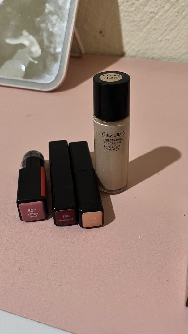 Shiseido Radiant Lifting Foundation & Lipsticks (Category: Makeup) located in Santa Rosa. Submitted by pixienewpixie (Listing ID 1460236909, Image 1). Description: - Shiseido Radiant Lifting Foundation - Shade: B40 - Includes 3 lipsticks: - Shade 526 Kitten Heel - Shade 106 Redwood - 101 Ginkgo - Perfect makeup bundle for your collection..