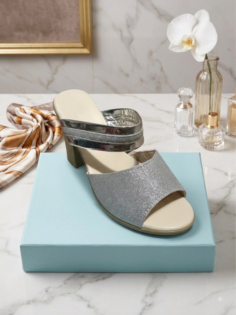 Silver Glitter Block Heel Mules Sandals (Category: Heels) located in Abucay. Submitted by luckyfox_1f1ab5 (Listing ID 1460112046, Image 3). Description: - Sparkly silver glitter mules - Open toe design - Comfortable block heel - Easy slip-on style - Straps with a metallic sheen - Ideal for dressing up outfits Size US 9.5 Used only once. Decluttering..