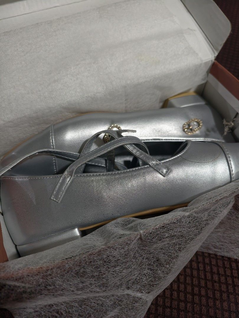 Silver Mary Jane Shoes with Strap and Buckle (Category: Flats & Sandals) located in Cavite. Submitted by drdct91 (Listing ID 1460177962, Image 2). Description: - Chic silver Mary Jane shoes - Features a secure strap with buckle closure - Durable, sturdy sole for comfort and stability - Ideal for parties, events, and special occasions - Presented in a box with protective tissue paper - Feel free to ask any questions!.