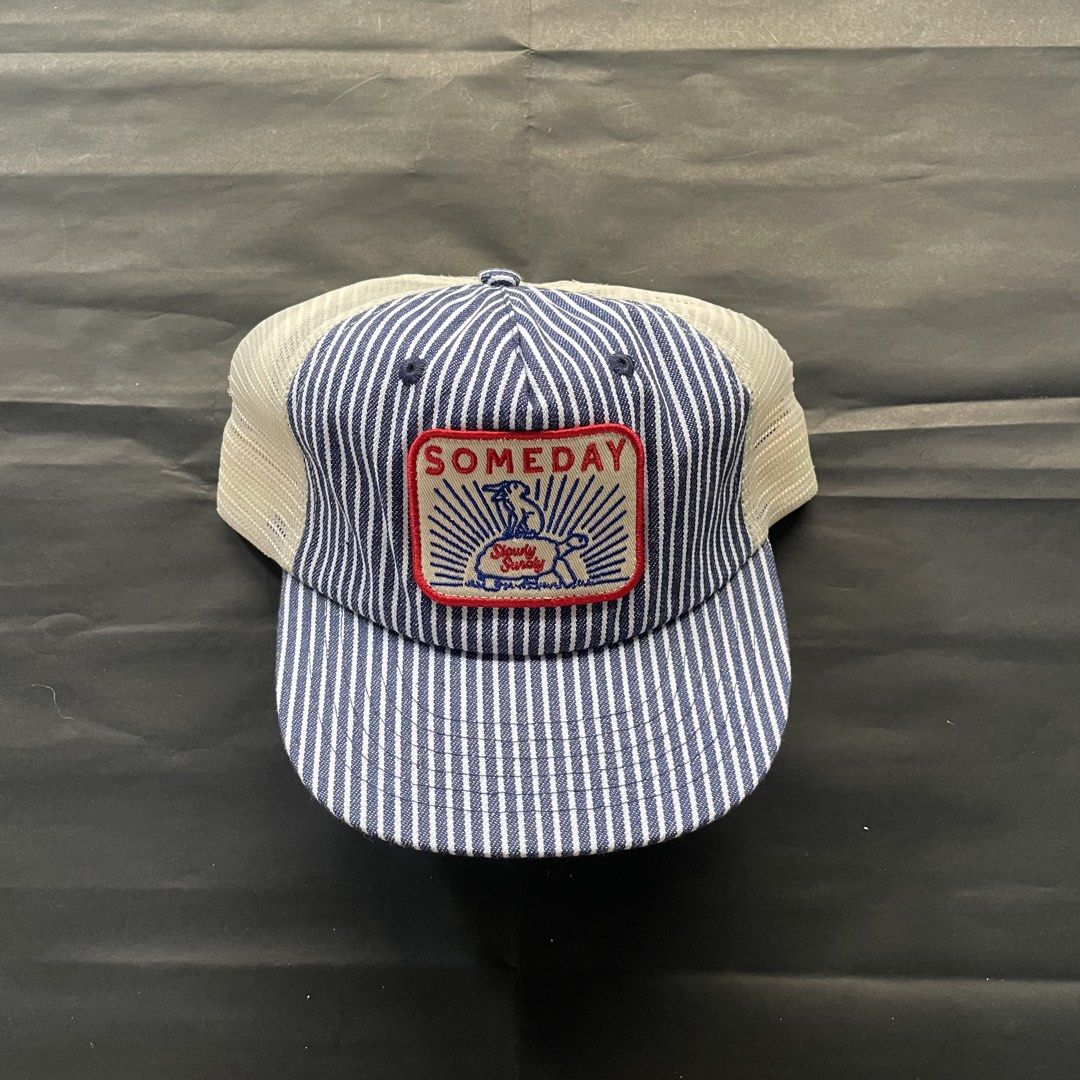 Someday Fabrications Hickory Trucker (Category: Caps & Hats) located in Manila. Submitted by sydge_ (Listing ID 1460172836, Image 1). Description: - Blue and white striped trucker hat - Features a 'Someday' patch with a bunny graphic - Mesh back for excellent breathability - Adjustable strap for a custom fit - Ideal for everyday casual wear.