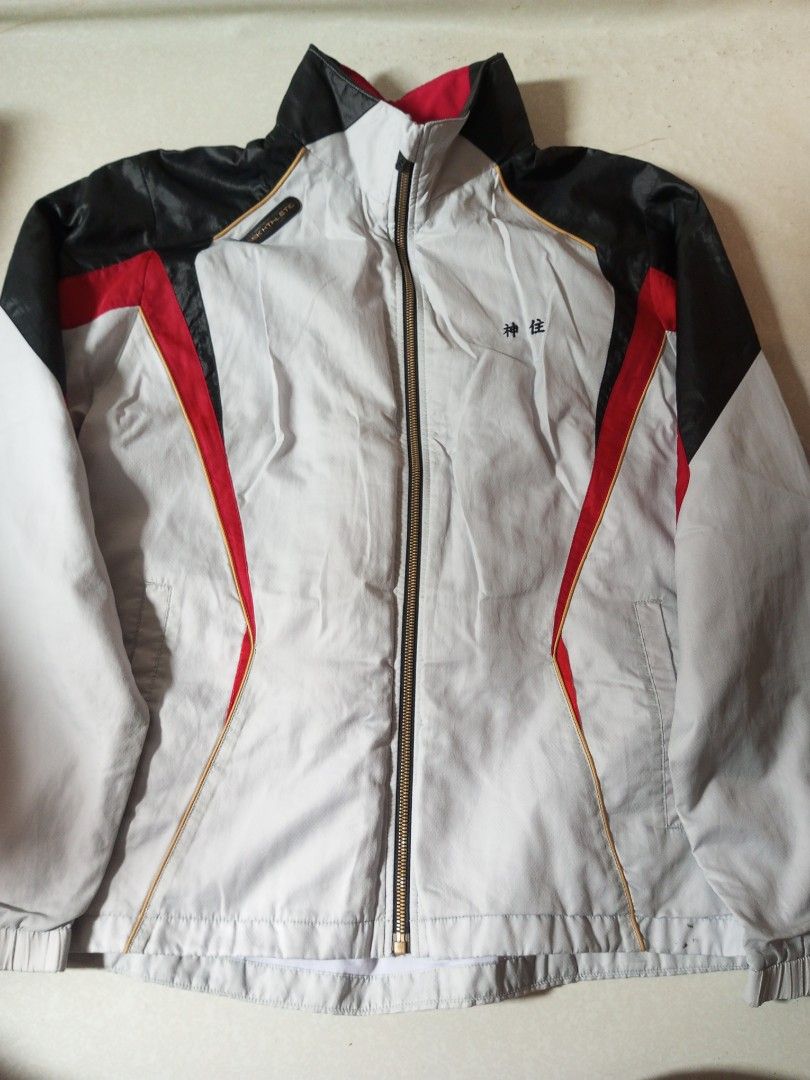 Sports Jacket with Japanese Text (Category: Coats, Jackets and Outerwear) located in Malolos. Submitted by radapostol (Listing ID 1460161145, Image 1). Description: - Lightweight sports jacket - Stylish color mix: grey, black, red, and gold accents - Unique Japanese character embroidery on chest - Full zip closure for easy wear - Elasticated cuffs and hem for a snug fit - Ideal for athletic activities or everyday casual style.