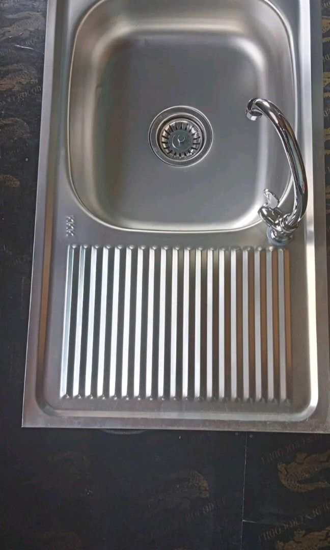 Stainless kitchen sink complete set with drainboard (Category: Bathroom & Kitchen Fixtures) located in Manila. Submitted by muranglababo_ph2026 (Listing ID 1460167803, Image 1). Description: With drainboard complete set Fitting and faucet 17x29 inches 6 inches deep P1500 Location: Binondo Manila Payment; cod or gcash Delivery thru lalamove ☎ 09281643138.