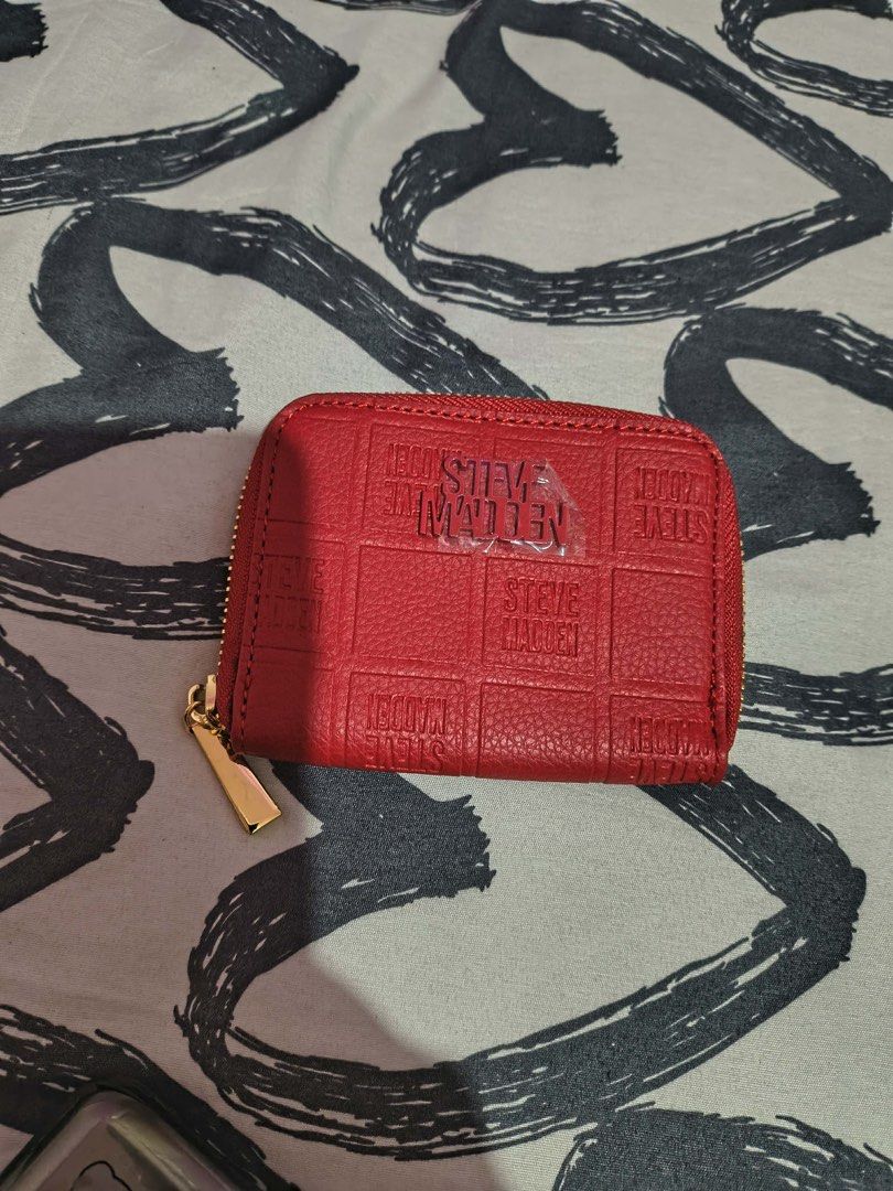 Steve Madden Card Wallet pouch (Category: Wallets & Card holders) located in Cavite. Submitted by littlesweetshop (Listing ID 1460145534, Image 1). Description: as is without sling brandnew mop gcash plus sf - Red Steve Madden coin pouch - Zip-around closure - Interior card slots - Gold hardware detail - Small and compact design - Ideal for organizing coins and cards.
