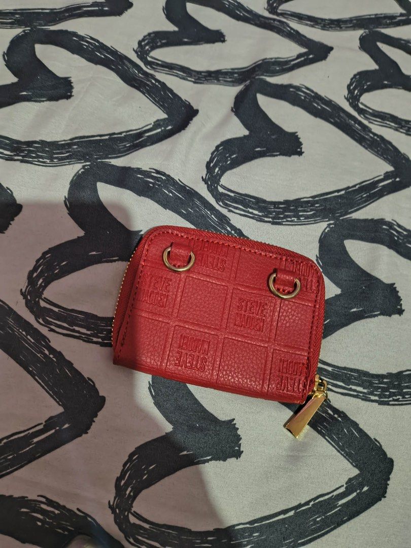 Steve Madden Card Wallet pouch (Category: Wallets & Card holders) located in Cavite. Submitted by littlesweetshop (Listing ID 1460145534, Image 2). Description: as is without sling brandnew mop gcash plus sf - Red Steve Madden coin pouch - Zip-around closure - Interior card slots - Gold hardware detail - Small and compact design - Ideal for organizing coins and cards.