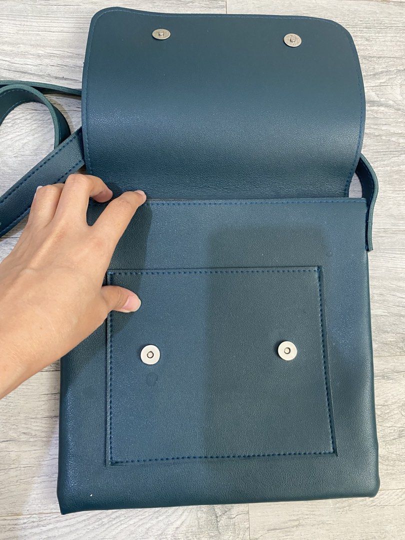 Straightforward Teal Leather Crossbody Bag (Category: Cross-body Bags) located in Imus. Submitted by majiwaji (Listing ID 1460177902, Image 3). Description: - Teal leather crossbody bag by Straightforward - Front pocket with magnetic closure - Main compartment and inner pocket - Adjustable strap for comfort - Simple, functional, and ideal for daily use.