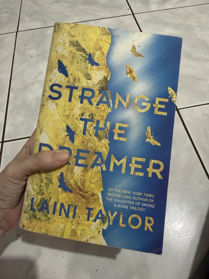 Strange the Dreamer by Laini Taylor (Category: Storybooks) located in Bulacan. Submitted by mariaanaligaya (Listing ID 1460127860, Image 1). Description: - Strange the Dreamer by Laini Taylor - New York Times Bestselling Author - Fantasy Novel - Pages have slightly yellowed due to age - Some pages have highlighting and notes - Great read for fantasy lovers.