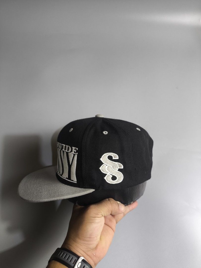 Stussy Worldwide Snapback Cap Black Grey (Category: Caps & Hats) located in Tibiao. Submitted by simjulian13893 (Listing ID 1460285278, Image 2). Description: - Classic Stussy snapback cap - Black crown with white 'Worldwide Stussy' embroidery - Grey brim - Stussy logo on side and inside tags - Material: Acrylic and wool blend - Size: One size fits most.