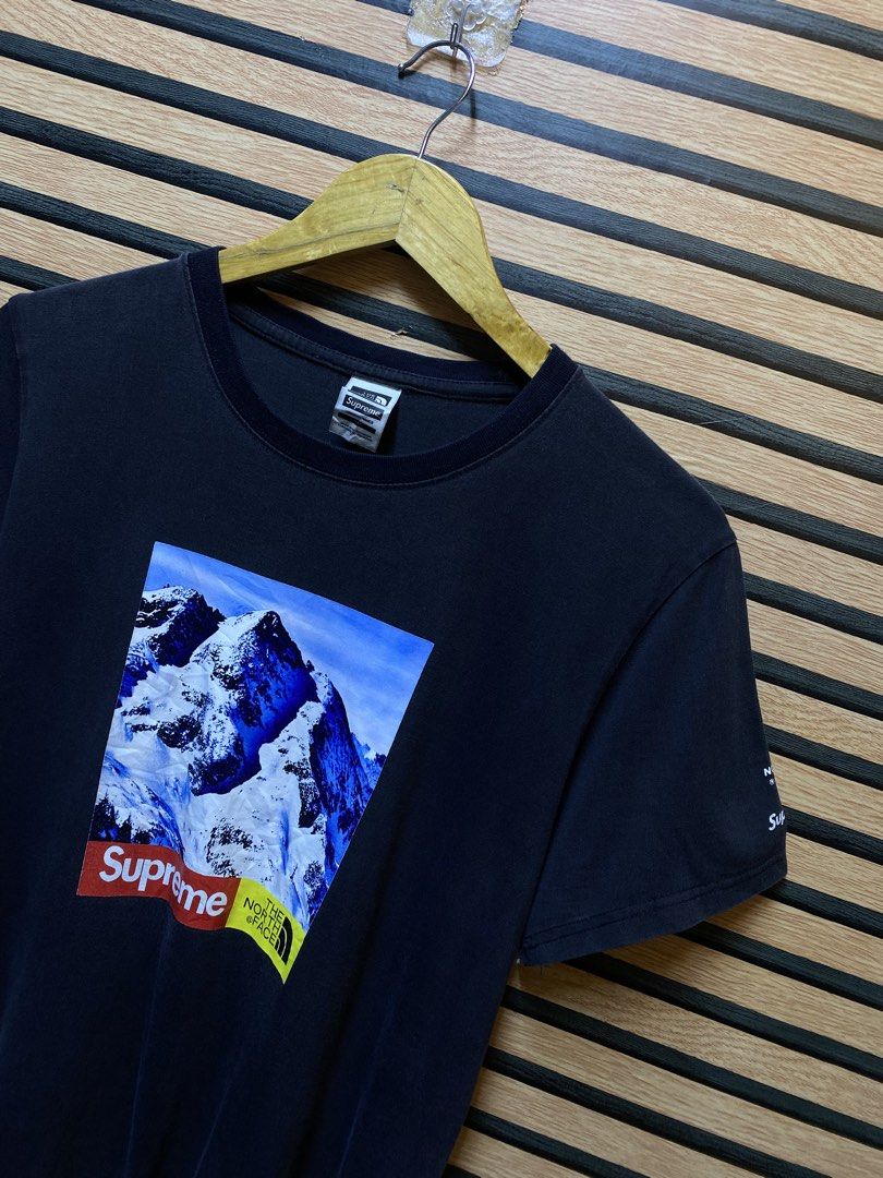 SUPREME X THE NORTH FACE “ Mountain tee” (Category: Tshirts & Polo Shirts ) located in Makati City. Submitted by drip.poww (Listing ID 1460230062, Image 3). Description: - Supreme x Tnf - Color: Black - Size: Large - Dimes: 22x27 - Authentic - Excellent condition - Need wash, fresh from bale - Material: 100% Cotton Please don’t expect too much—these are thrifted (ukay) items. 😊 !!STILL NEGOTIABLE!!.