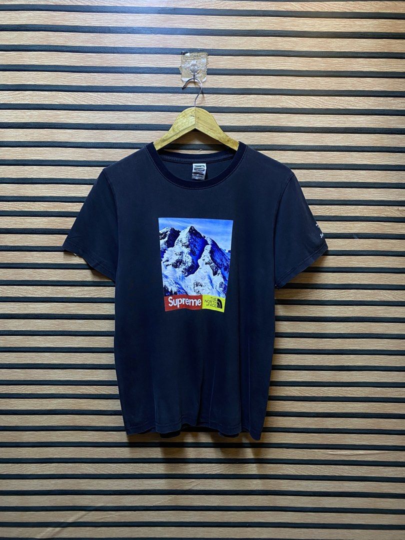 SUPREME X THE NORTH FACE “ Mountain tee” (Category: Tshirts & Polo Shirts ) located in Makati City. Submitted by drip.poww (Listing ID 1460230062, Image 2). Description: - Supreme x Tnf - Color: Black - Size: Large - Dimes: 22x27 - Authentic - Excellent condition - Need wash, fresh from bale - Material: 100% Cotton Please don’t expect too much—these are thrifted (ukay) items. 😊 !!STILL NEGOTIABLE!!.