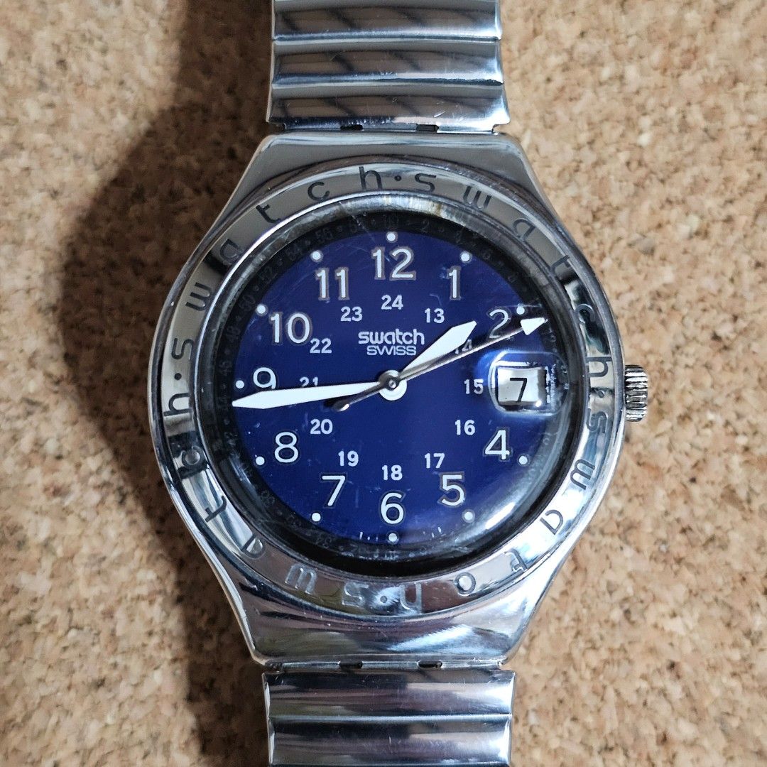 Swatch Irony Happy Joe Blue (Category: Men's Watches) located in Makati City. Submitted by piw.wip (Listing ID 1460167533, Image 1). Description: ⌚ Swatch Irony Happy Joe Blue Condition: Very Good | Working Movement: Quartz Size: 37mm case diameter | Fits up to size 7 wrists Flaws: Light scratches | Internal crack (see last photo) ❗️Please Note: Review all photos carefully as they form part of the description. Signs of use are expected on pre-own